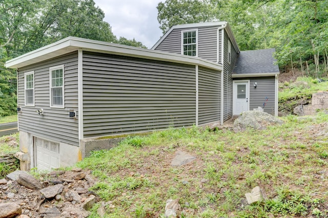 view of side of home featuring a garage