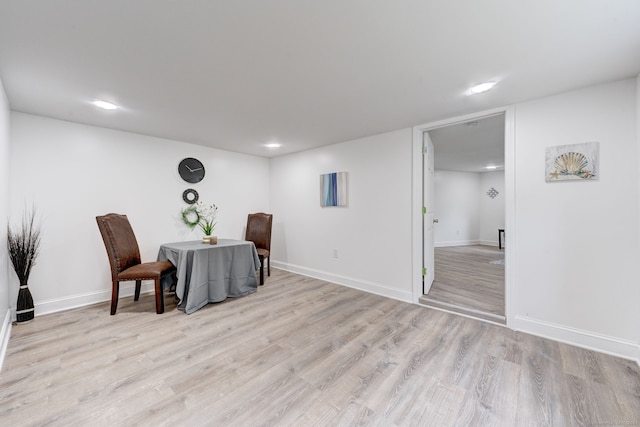 living area with light hardwood / wood-style flooring