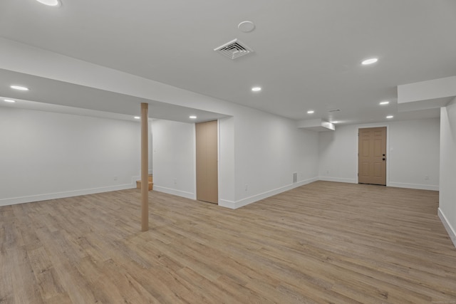 basement featuring light hardwood / wood-style flooring