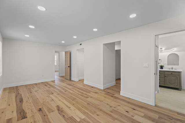 unfurnished room with light hardwood / wood-style floors