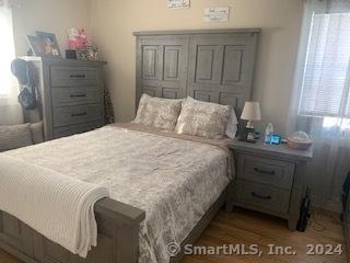 bedroom featuring dark hardwood / wood-style floors