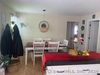 dining room with wood-type flooring