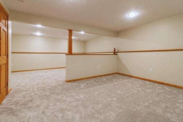 finished below grade area featuring carpet and baseboards