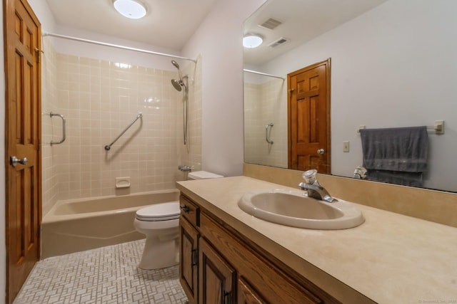full bathroom featuring toilet, vanity, and bathtub / shower combination