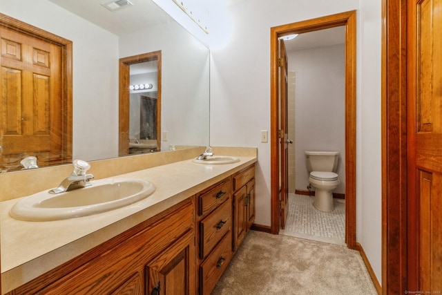 55 Mill Plain Rd Unit 20-5, Danbury, CT 06811 - full bath with double vanity, toilet, and baseboards