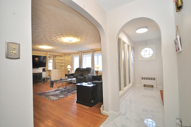 foyer entrance featuring radiator heating unit