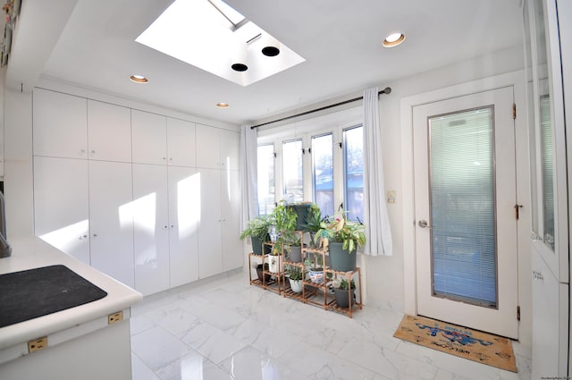 entryway featuring a skylight