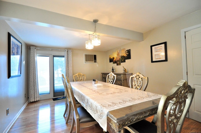 dining room featuring a chandelier, hardwood / wood-style flooring, and beamed ceiling