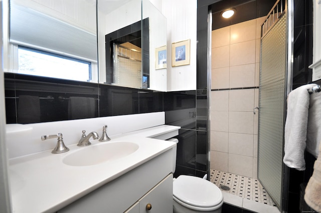 bathroom featuring walk in shower, vanity, and toilet