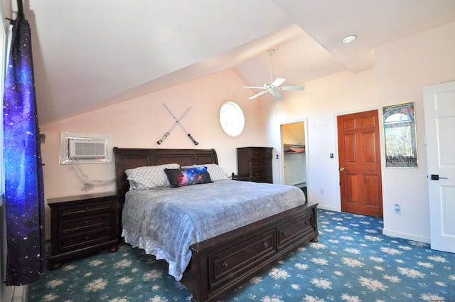 carpeted bedroom featuring ceiling fan, a wall mounted air conditioner, vaulted ceiling, a walk in closet, and a closet