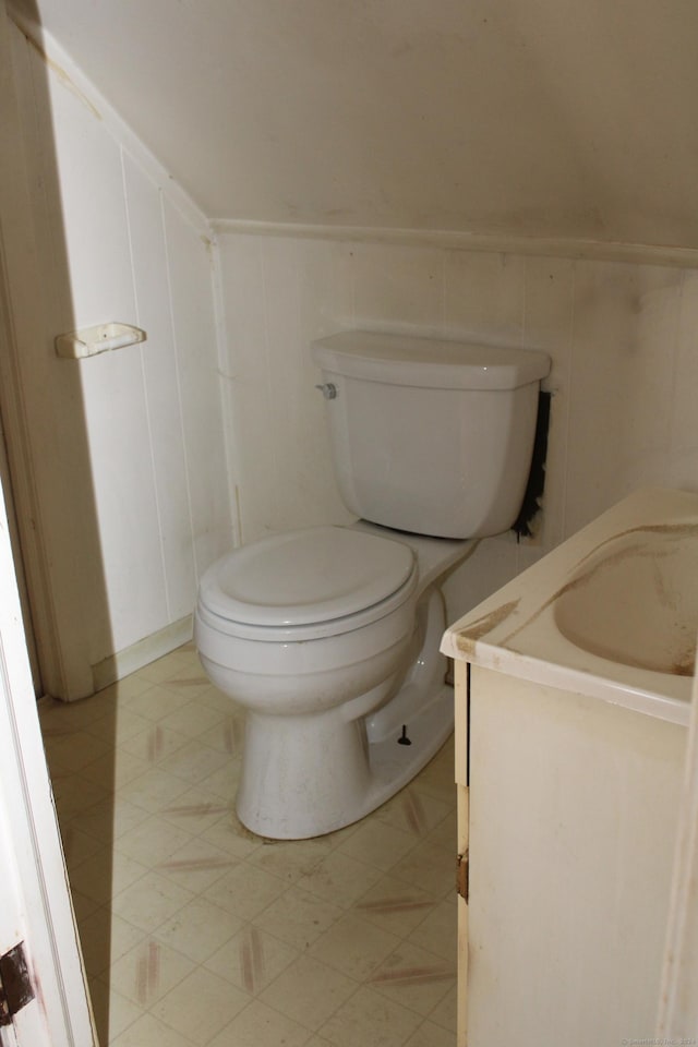 bathroom featuring toilet and vanity