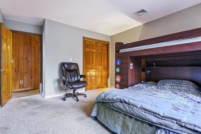 carpeted bedroom featuring a closet