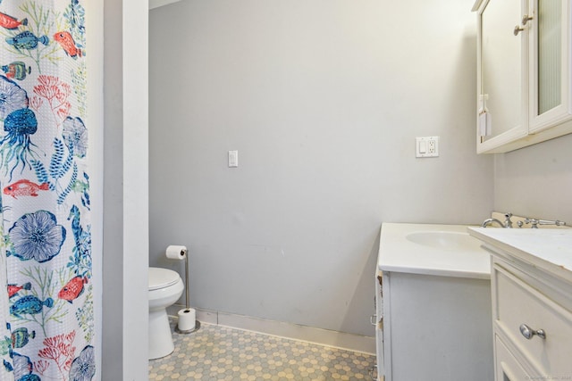 bathroom featuring vanity and toilet