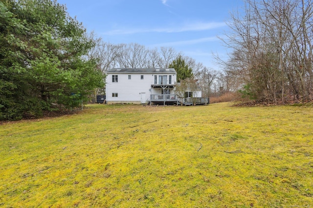 view of yard featuring a wooden deck