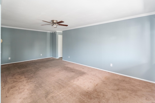 carpeted empty room with ceiling fan and ornamental molding