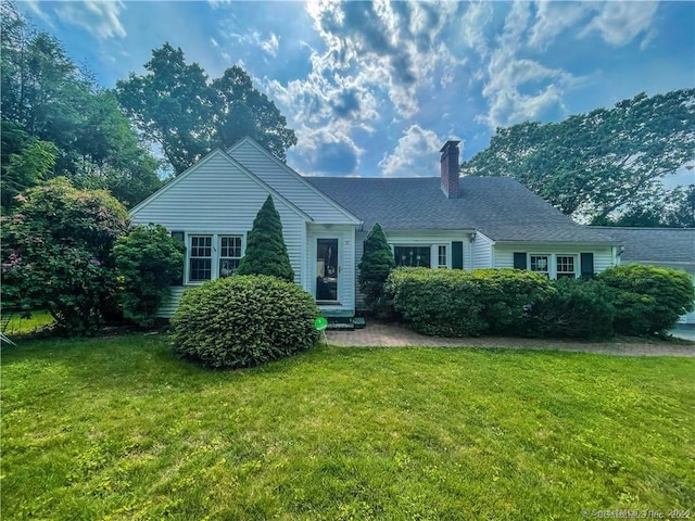 view of front of home with a front yard