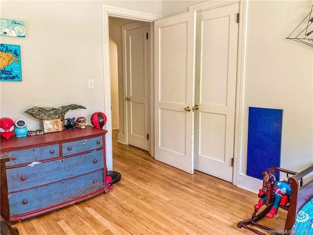 bedroom with light hardwood / wood-style flooring