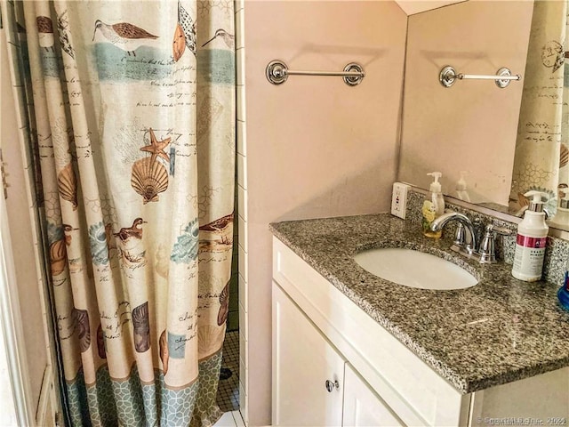 bathroom with vanity and walk in shower