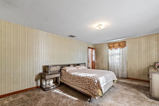 bedroom with dark colored carpet