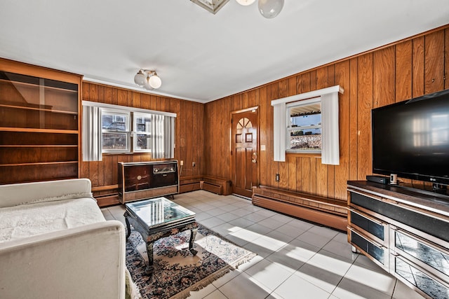 tiled living room with wood walls and a baseboard radiator