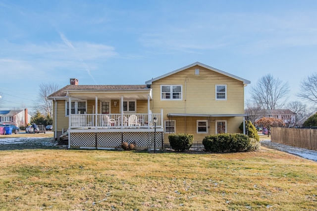 tri-level home with a porch and a front lawn