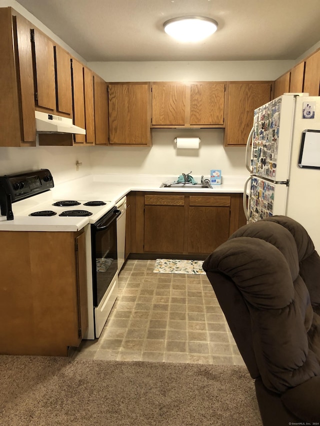 kitchen featuring white appliances and sink