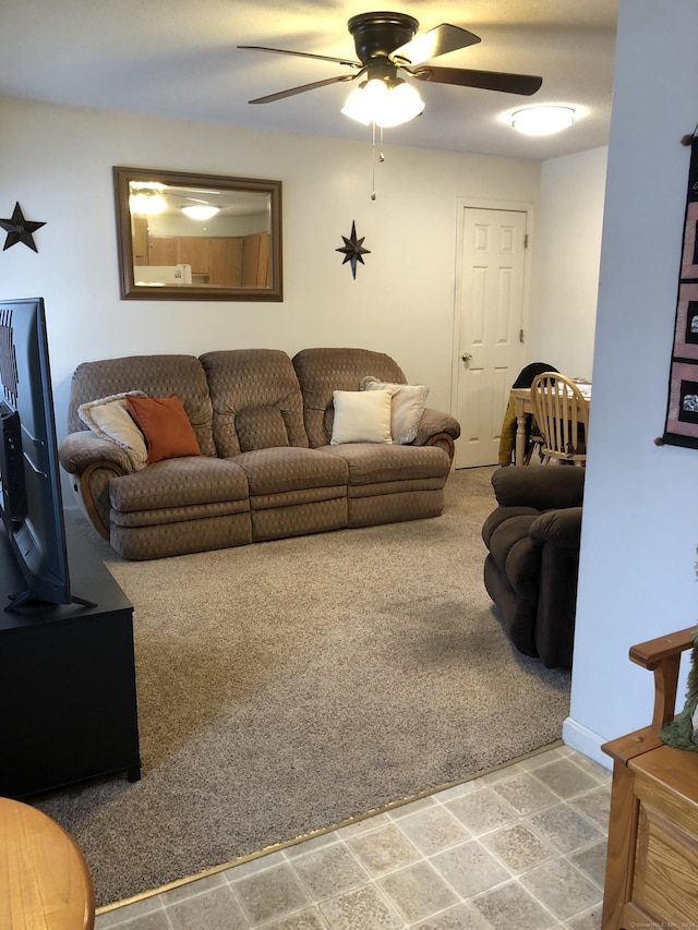 living room with carpet floors and ceiling fan