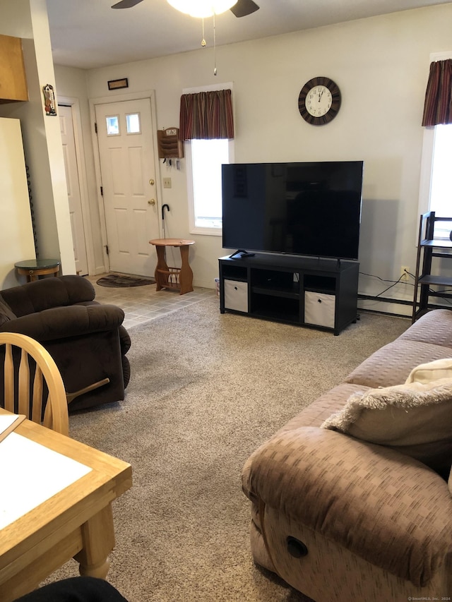 living room with carpet and ceiling fan