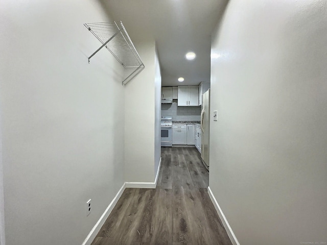 corridor with dark wood-type flooring