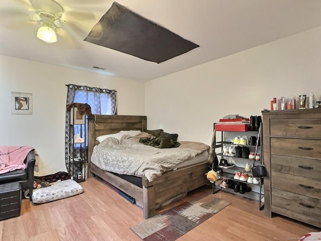 bedroom featuring ceiling fan and light hardwood / wood-style flooring