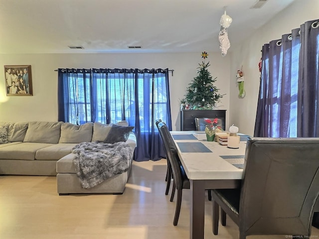 dining space featuring light hardwood / wood-style floors