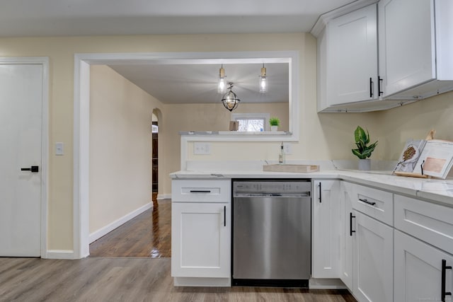 kitchen with dishwasher, light stone counters, pendant lighting, white cabinets, and hardwood / wood-style flooring