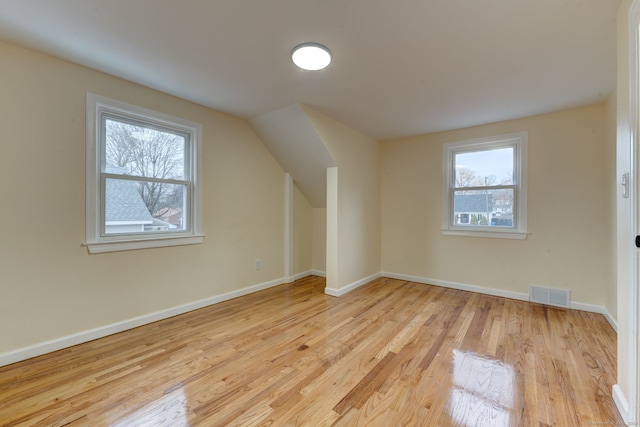 bonus room with light wood-type flooring