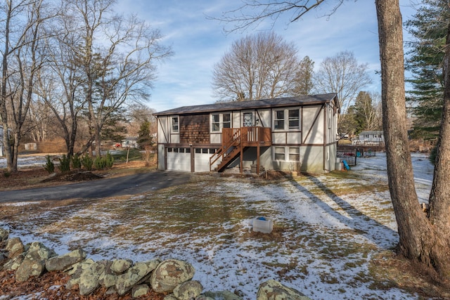 view of front facade featuring a garage and a deck