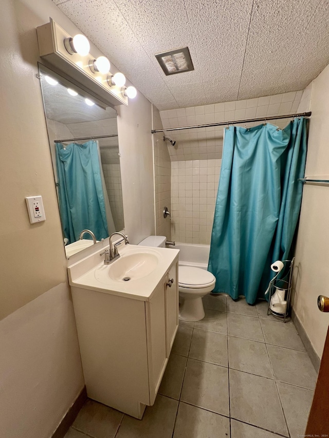 full bathroom featuring tile patterned flooring, vanity, shower / tub combo, and toilet