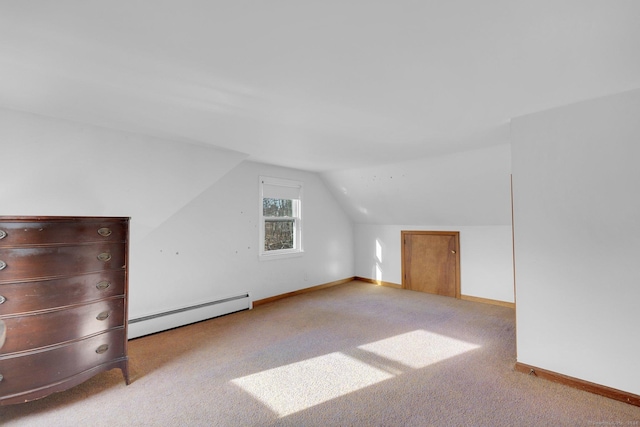 bonus room with light carpet, a baseboard radiator, and lofted ceiling