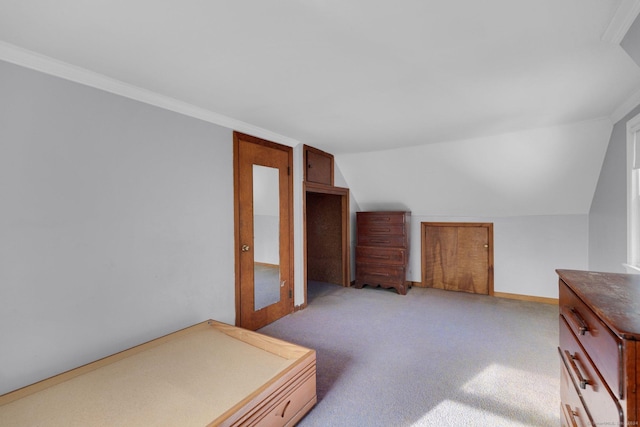 interior space featuring lofted ceiling, light colored carpet, and crown molding