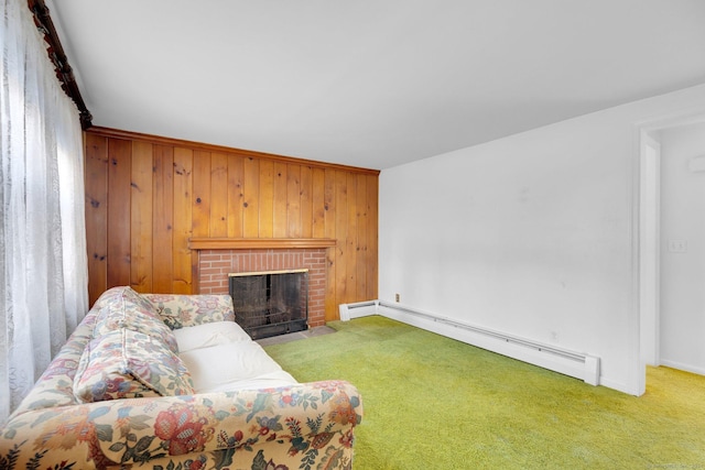 carpeted living room featuring wood walls, a fireplace, and a baseboard heating unit