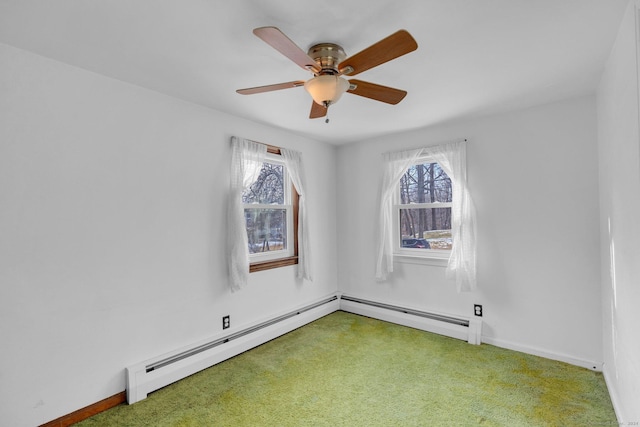 carpeted empty room with a wealth of natural light and ceiling fan