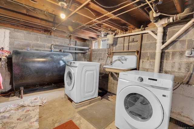 laundry room featuring separate washer and dryer and sink