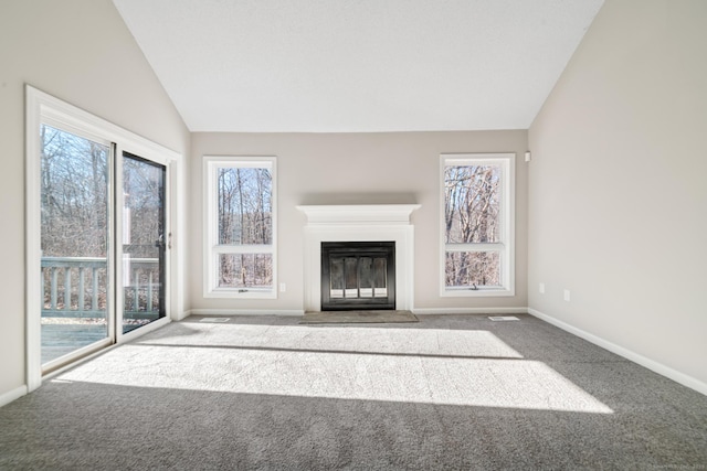 unfurnished living room featuring lofted ceiling and carpet floors