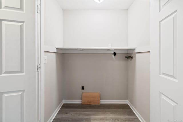 washroom featuring wood-type flooring, hookup for an electric dryer, and hookup for a washing machine