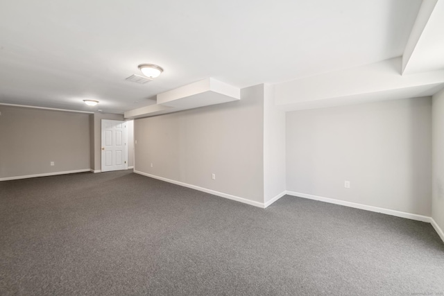 basement with dark colored carpet