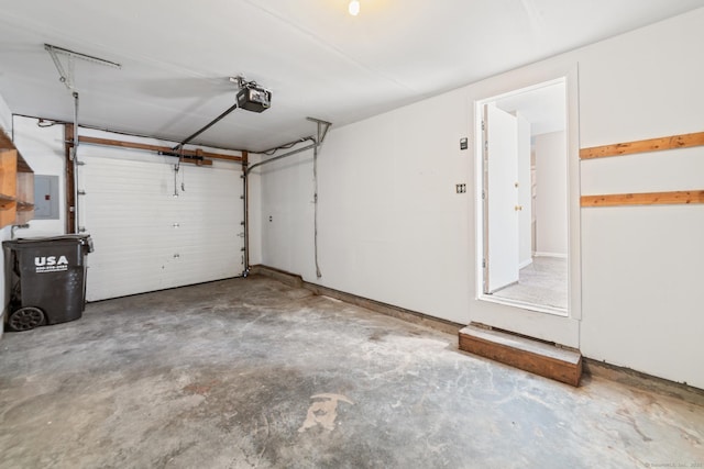 garage featuring a garage door opener and electric panel