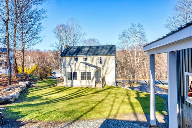 back of house with a yard