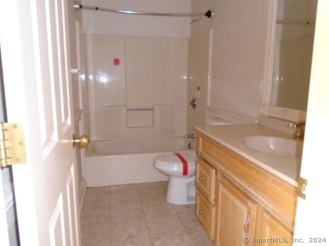 full bathroom featuring tile patterned flooring, vanity, toilet, and shower / bathtub combination