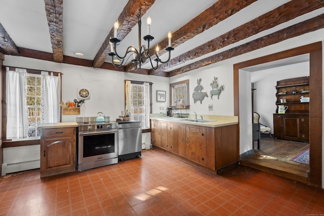 kitchen featuring sink, appliances with stainless steel finishes, baseboard heating, a notable chandelier, and beamed ceiling