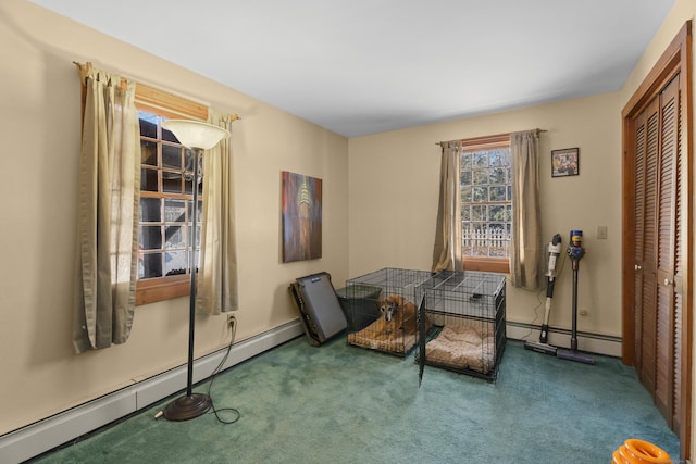 interior space with a baseboard radiator and dark colored carpet