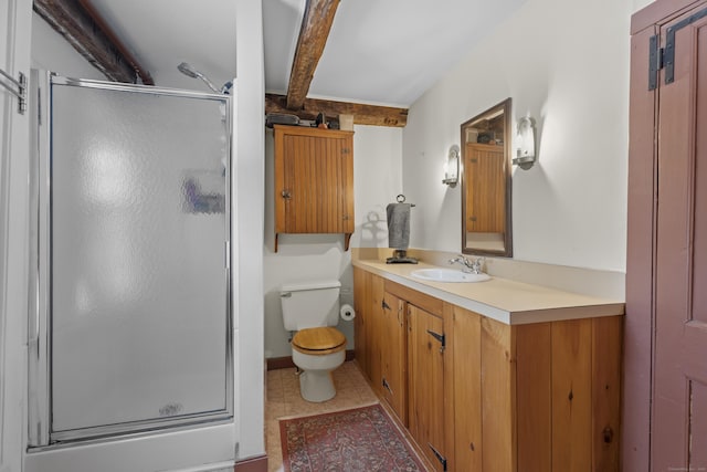 bathroom with vanity, tile patterned flooring, toilet, and walk in shower