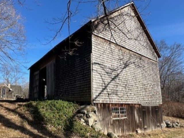 view of side of property with an outdoor structure